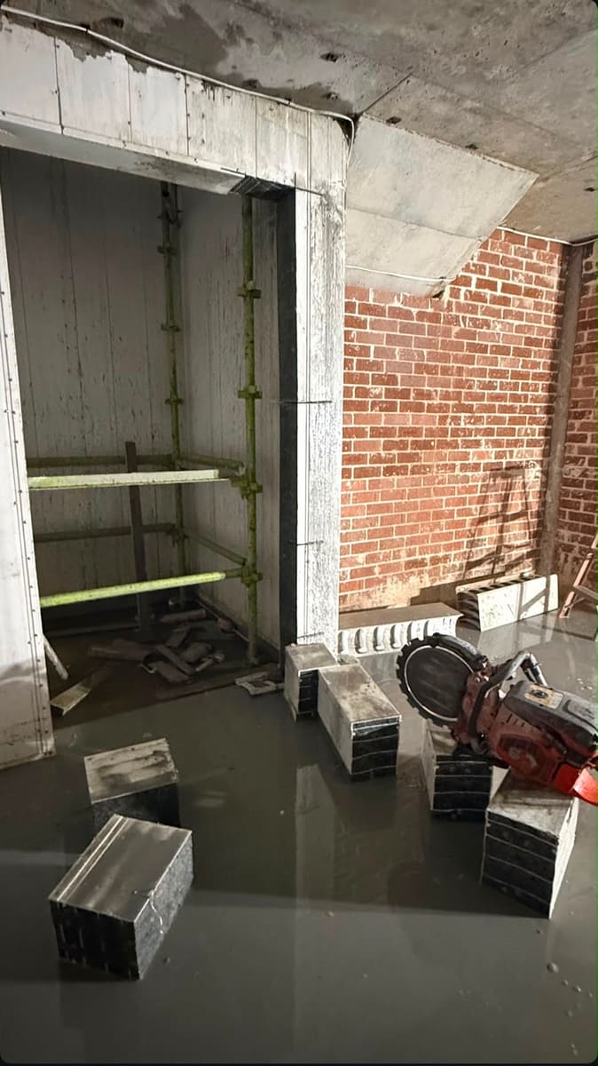 New doorway opening cut through a brick wall
