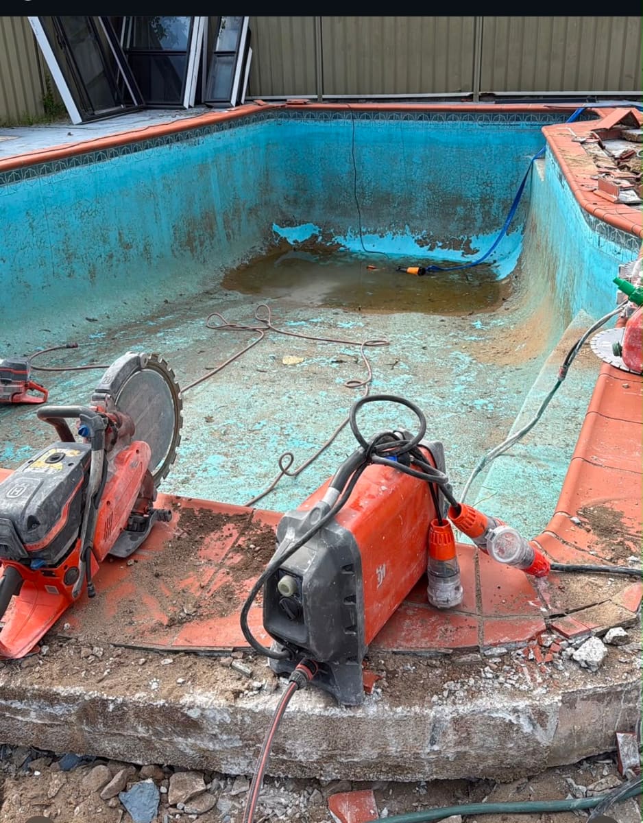 Cutting a concrete pool shell into sections for demolition and removal, Sydney