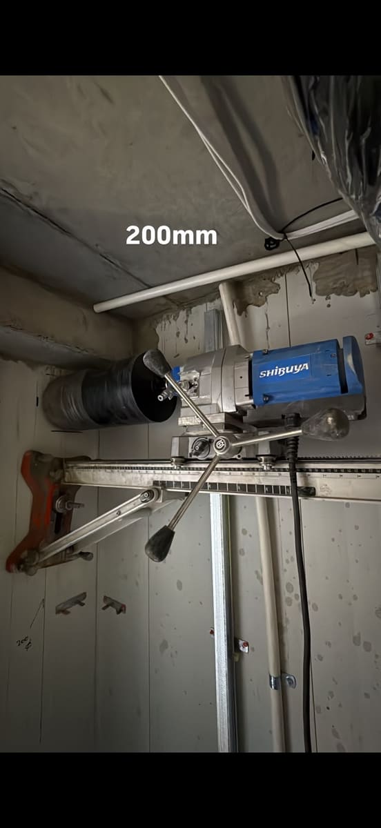 Core drilling rig set up for a 200mm hole through a concrete wall