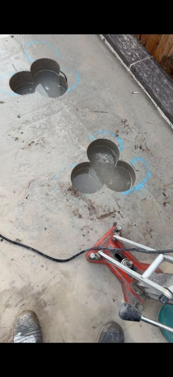Overlapping core holes drilled through a concrete slab