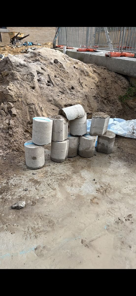 Core drilled penetrations and pipe sleeves on a civil works site